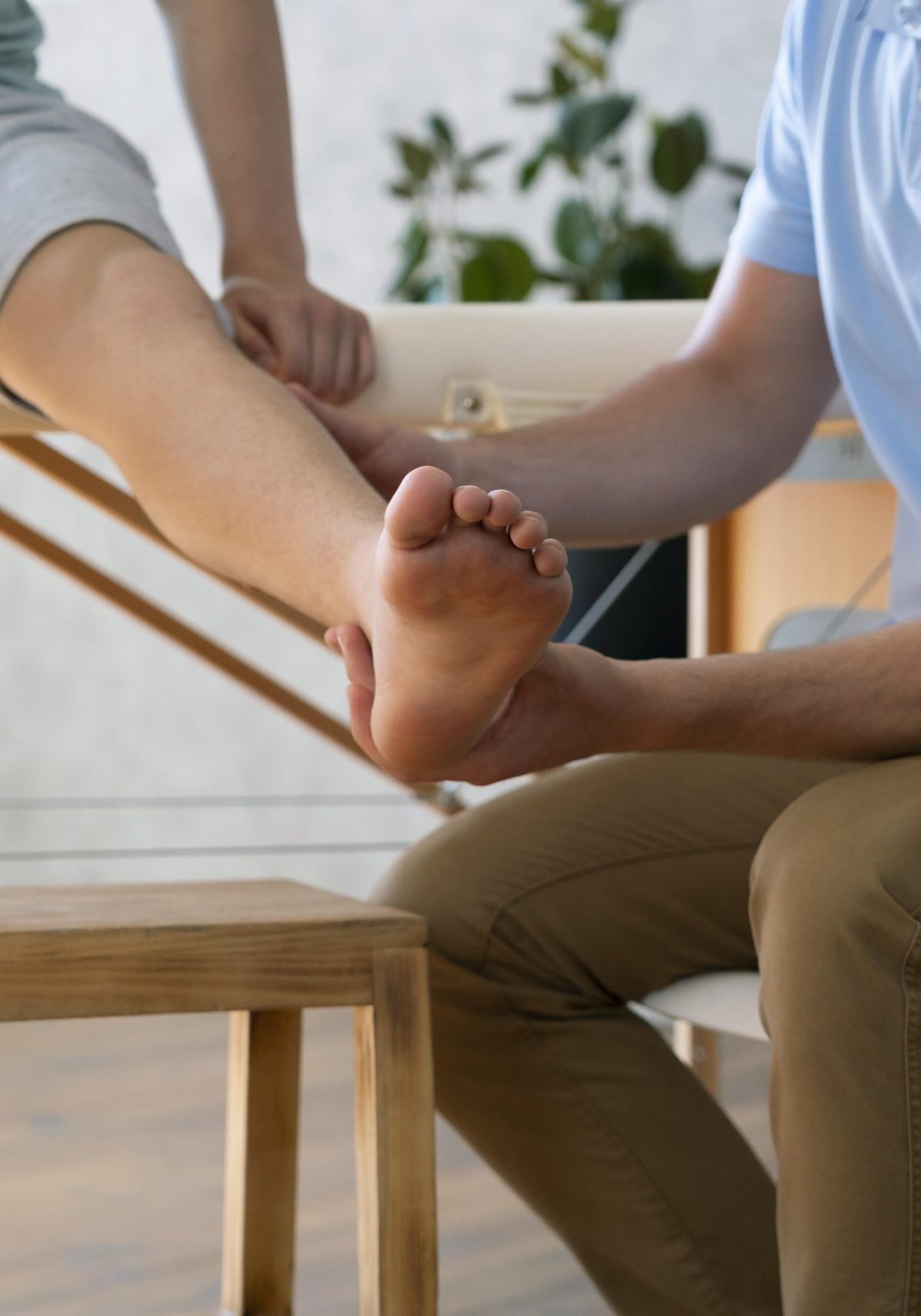 close-up-doctor-holding-leg (3)